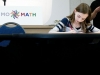 A student answering a tie-breaker question at MoMath\'s Second Annual Suffolk County Middle School Math Tournament