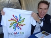 Bill Nye showing off a MoMath T-shirt