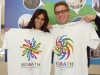 The cast of NCIS Los Angeles showing off their MoMath T-shirts
